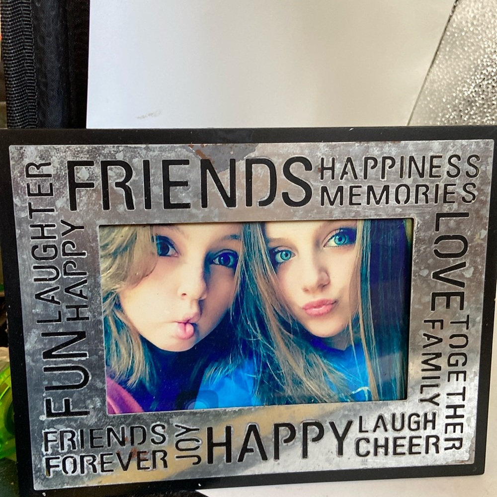 Picture frame for photo 4” x 6” outside frame is 8 1/2 x 6 3/4”. Silver & black